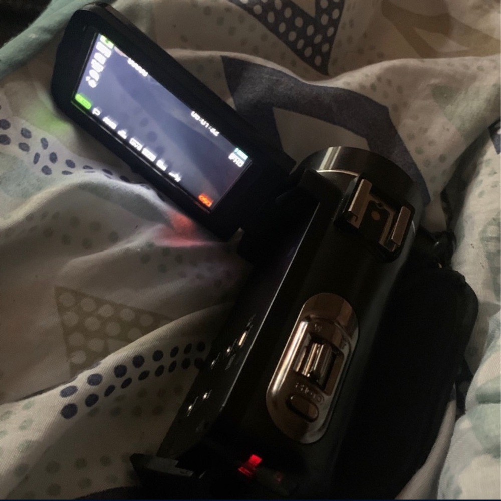 A Dv camera comes with the case to hold it and the charger